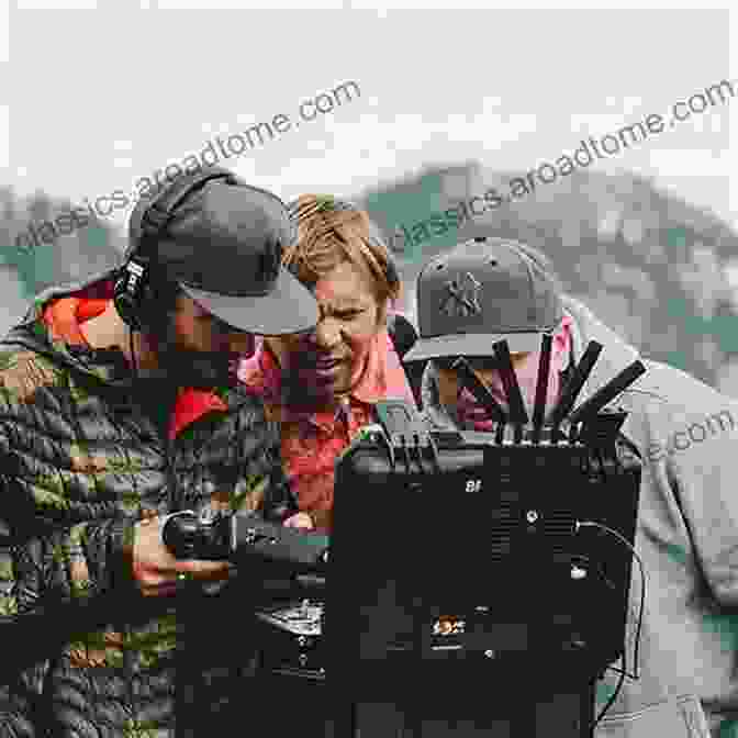 Andy Bradley Holding A Camera In A Field Ph1 Andy Bradley